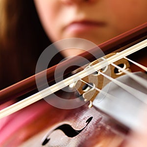 Young Woman Playing Violin - Musical Instrument - Viola - Close-up