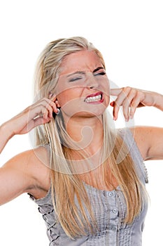 Young Woman Plugging Ears photo
