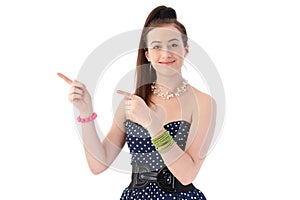 Young woman pointing with both hands