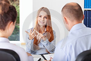 Young woman pointing her advantages during the recruitment interview