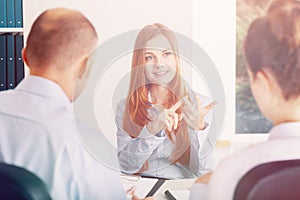 Young woman pointing her advantages during the recruitment interview