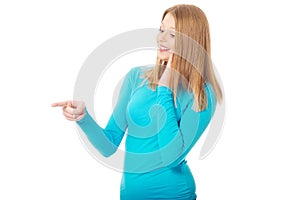 Young woman pointing to the left