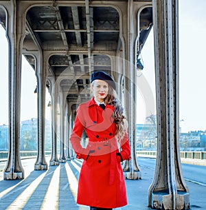 Young woman on Pont de Bir-Hakeim bridge in Paris