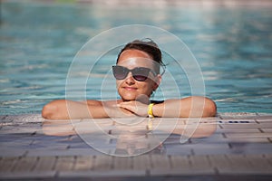 Young woman and pool