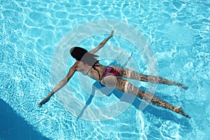 Young woman in the pool.