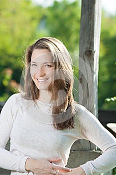 Young woman portrait with beautiful hair outdoor smiling