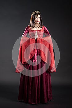 Young woman portrait in red dress