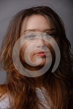 young woman portrait in studio, double exposure. split personality