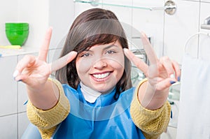 Young woman portrait visiting the dentist office and smiling