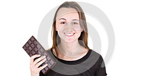 Young woman portrait on white background with chocolate bar smiling laughing