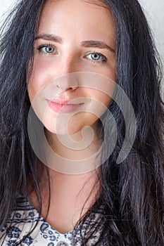 Young woman portrait on the white background, not isolated