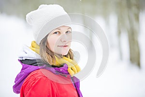 Young woman portrait in the white snow