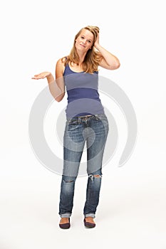 Young woman poses with shrugged shoulders