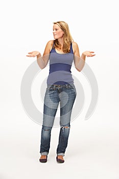 Young woman poses with shrugged shoulders photo
