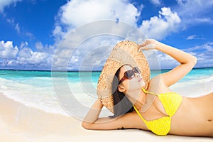 Young woman posing in bikini on the beach