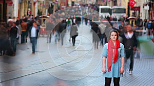 Young woman posing, busy street, people walking around, 4K