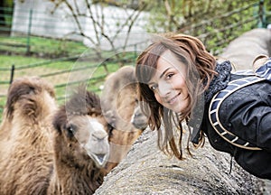 Young woman posing with camel