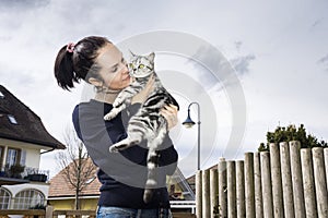 Young woman posing with a cat