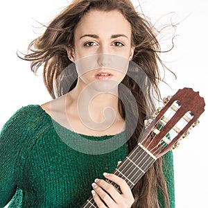 Young woman posing with guitar