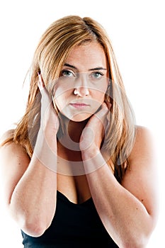 Young woman posing with her hands on her face