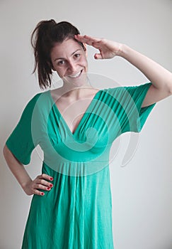 Young woman posing for military salute photo