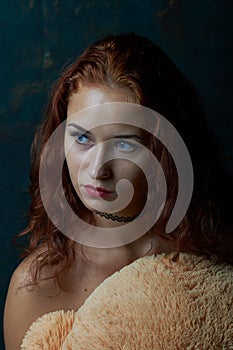 Young woman posing in a studio