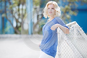 Young woman posing in summer outdoors