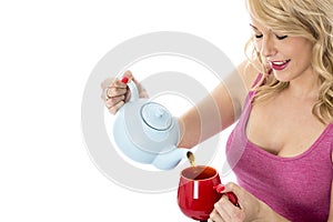 Young Woman Pouring Tea from a Teapot