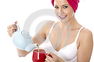 Young Woman Pouring Tea from a Teapot