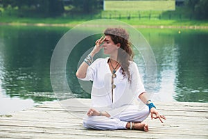 Young woman practice yoga breathing techniques outdoor photo
