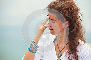 Young woman practice yoga breathing techniques outdoor photo