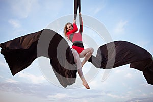 Young woman practicing aerial sylks