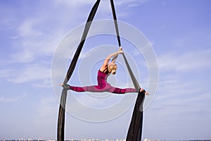 Young woman practicing aerial sylks