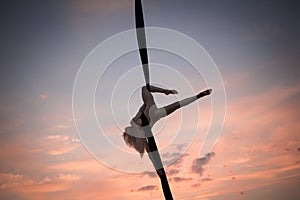 Young woman practicing aerial sylks