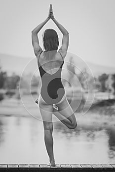 Young woman is practicing yoga