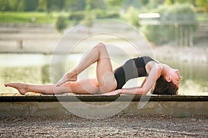 Young woman is practicing yoga