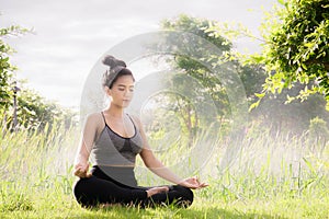 Young woman practicing yoga Everyday Yoga helps in concentration