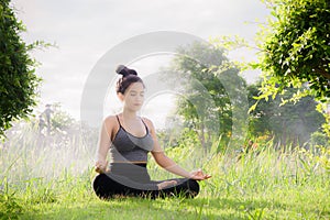 Young woman practicing yoga Everyday Yoga helps in concentration