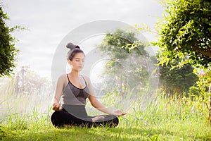 Young woman practicing yoga Everyday Yoga helps in concentration