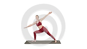 Young woman practicing yoga, finishes doing Utthita parsvakonasana exercise on white background.