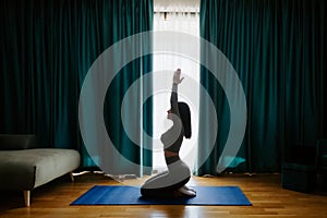 Young woman practicing yoga at home. meditation practice