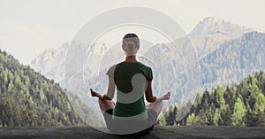 Young woman practicing yoga in mountains at sunset panoramic banner. Harmony, meditation, healthy lifestyle concept