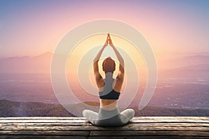 Young woman practicing yoga in the nature, Female happiness, Young woman is practicing yoga at mountain