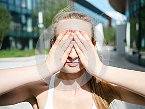 young woman practicing yoga outdoor and making pranayama - special yoga breath practice