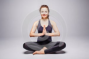 Young woman practicing yoga perfect or lotus pose