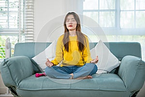 Young woman practise yoga and meditation in lotus position