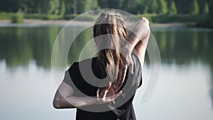 Young woman practising yoga outdoors