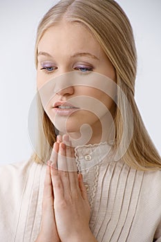 Young woman praying