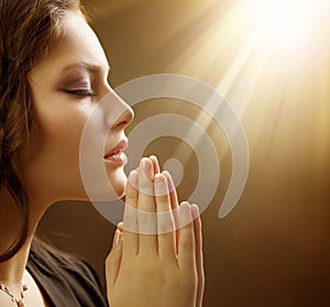 Young Woman Praying Close-up photo