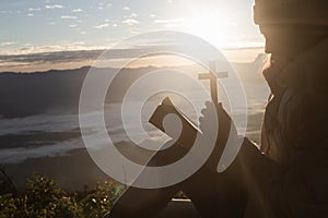 Young woman praying with hand, prayer concept for faith, spirituality and religion